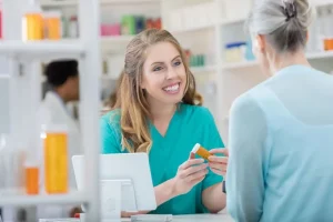 pharmacy tech working behind the counter