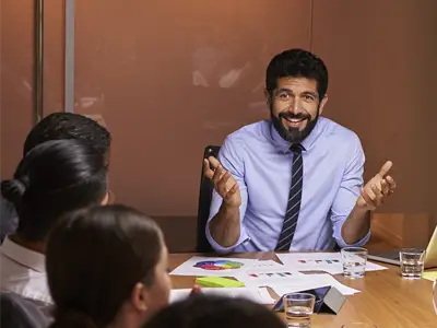 black male presenting in a meeting