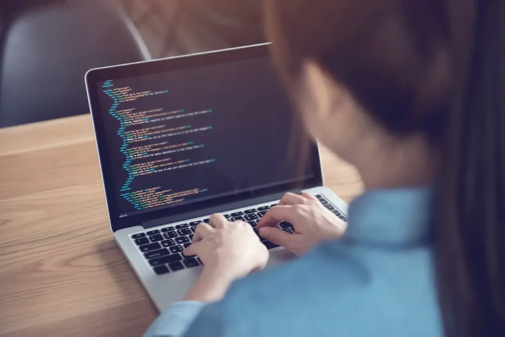 female software developer working on her computer