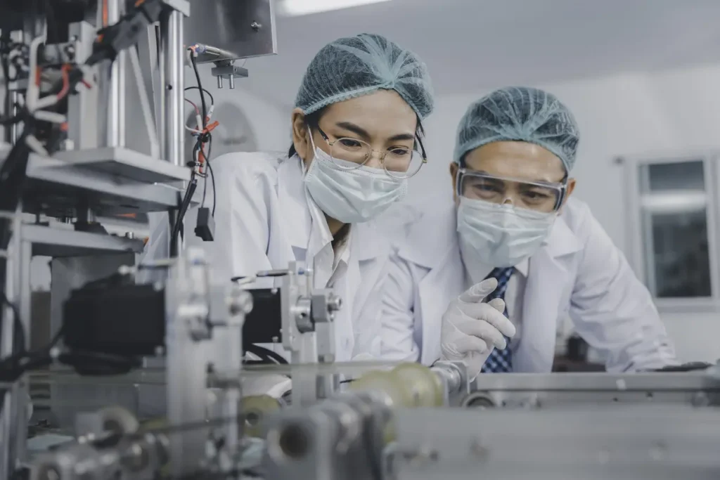 two sterile processing technician working together in lab coats