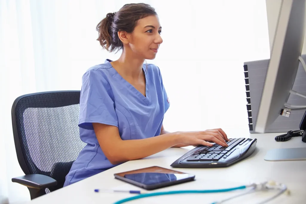 healthcare worker using the computer