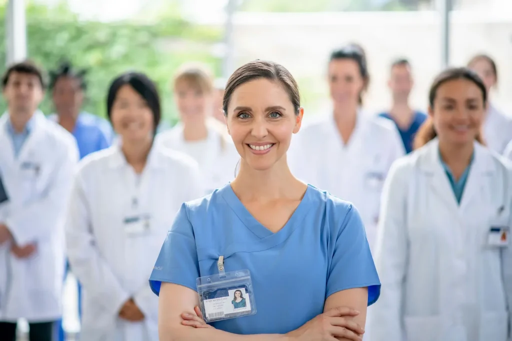 a group of healthcare workers smiling at camera