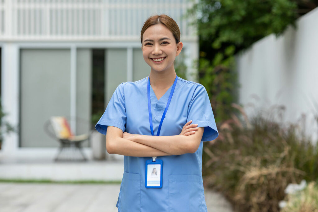 female healthcare worker smiling at camera