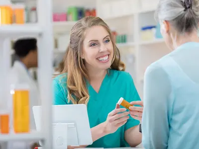pharmacy worker checking out medication